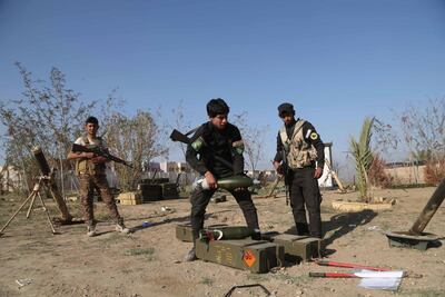 Young volunteer militia members prepare to attack ISIS fighters in Tikrit, north of Baghdad. AP, File