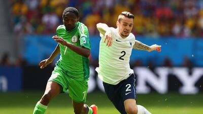 Ahmed Musa of Nigeria competes for the ball with Mathieu Debuchy of France during their match on Monday at the 2014 World Cup in Brasilia, Brazil. Quinn Rooney / Getty Images