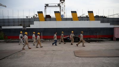 Workers arriving at the site of a still-under-construction replica of the Titanic ship in Daying County in China's southwest Sichuan province. AFP