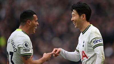 Son Heung-Min (R) celebrates scoring the team's third goal with Spanish defender Pedro Porro. AFP