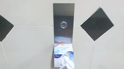 A tissue paper box stuck next to the elevator in a building in Jumeirah Village Circle, Dubai, to discourage residents from directly touching the button. Courtesy of Vikas S