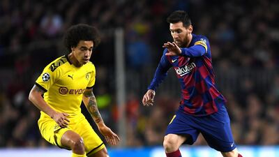 Lionel Messi under pressure from Axel Witsel. Getty