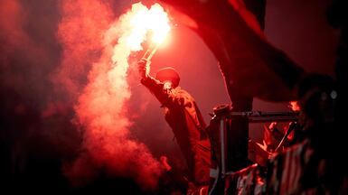 Midtjylland fans light flares during their team's Uefa Europa League football match against Celtic in Herning, Denmark. AFP