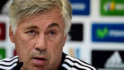Real Madrid's Italian coach Carlo Ancelotti attends a press conference at the Valdebebas training ground in Madrid on August 18, 2014, on the eve of the Spanish Super Cup match Real Madrid CF vs Atletico de Madrid. AFP PHOTO / GERARD JULIEN