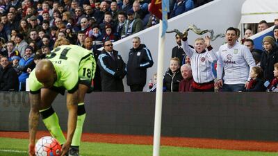 Aston Villa fans wave a toy snake at former player Fabian Delph, now with Manchester City, during Saturday's FA Cup contest. Darren Staples / Reuters