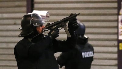 Police forces prepare in Saint-Denis, a northern suburb of Paris on Wednesday. Authorities in the Paris suburb of Saint-Denis are telling residents to stay inside during a large police operation near France’s national stadium that two officials say is linked to last week’s deadly attacks. Francois Mori / AP