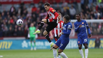 Brentford's Sergio Reguilon, left, controls the ball. AP