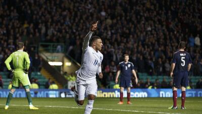 England's Alex Oxlade-Chamberlain celebrates after scoring a goal in England's 3-1 friendly win over Scotland on Tuesday at Celtic Park in Glasgow. Robert Perry / EPA