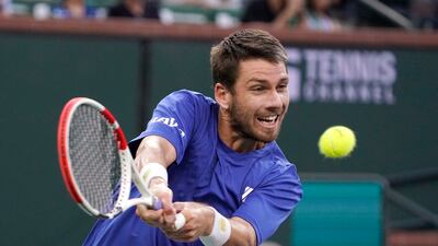 Cameron Norrie returns to Nikoloz Basilashvili. AP Photo