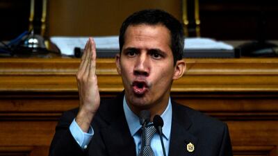 Venezuelan opposition leader and self-proclaimed acting president Juan Guaido gestures as he speaks during a session of the Venezuelan National Assembly in Caracas on March 6, 2019. AFP