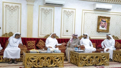 Sheikh Mohamed bin Zayed Al Nahyan, Crown Prince of Abu Dhabi and Deputy Supreme Commander of the UAE Armed Forces (2nd L) visits the house of Mohammed Saleh bin Megren Al Ameri (3rd L), in Zakhir. Seen with HE Brigadier General Saleh Mohamed Saleh Al Ameri, Commander of the UAE Ground Forces (L). Ministry of Presidential Affairs