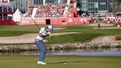 Rory McIlroy hits his approach into the 18th green during the second round of the Abu Dhabi HSBC Golf Championship on Friday. Ahmed Jadallah / Reuters