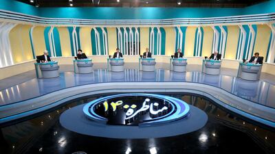 Iranian presidential candidates, Saeed Jalili, Ebrahim Raisi, Amirhossein Ghazizade, Alireza Zakani, Mohsen Rezaie, Mohsen Mehralizadeh, and Abdol Naser Hemati, during the first televised debate between Iran presidential candidates at the Iran State television studio in Tehran. AFP PHOTO /Iranian Young Journalist Club