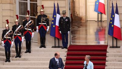 Mr Castex delivers a speech next to Ms Borne during the ceremony. AFP