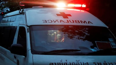 A rescue worker is seen in an ambulance believed to be carrying rescued schoolboys. Reuters