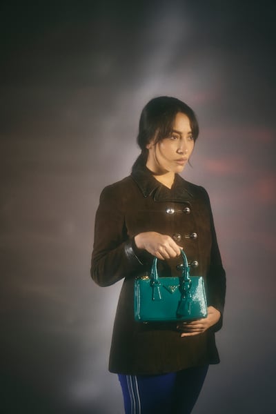 Double-breasted suede Caban jacket; fleece leggings; and Galleria leather bag, all from Prada