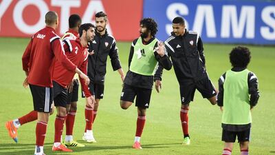 The UAE squad go through their stretches.