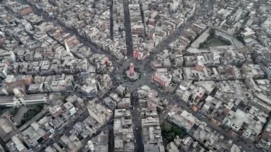 Commuters driving through a clock tower roundabout, formerly known as the Lyallpur Clock Tower, in Faisalabad, Pakistan. AFP