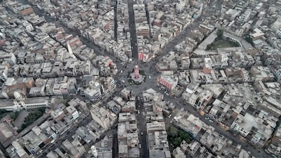 Commuters driving through a clock tower roundabout, formerly known as the Lyallpur Clock Tower, in Faisalabad, Pakistan. AFP