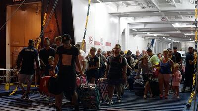 Tourists fleeing from Ischia Island arrive in Pozzuoli, near Naples. Cesare Abbate / EPA