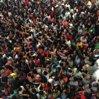 Shah Rukh Khan received a warm welcome from fans who turned out in their thousands at Abu Dhabi mall to see him. Antonie Robertson / The National