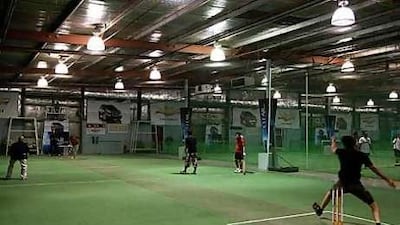 Above and below, employees of Nescafe play cricket at the Insportz club, a popular site for team-building exercises.