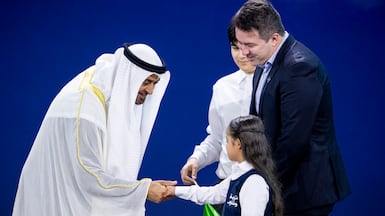 President Sheikh Mohamed congratulates representatives of Brazil's Jade, which won the health category in the 2026 Zayed Sustainability Prize. Hamad Al Kaabi / UAE Presidential Court