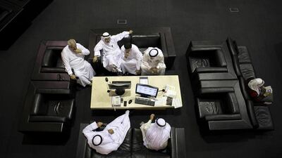 Anxious traders at the floor of the Dubai Financial Market. Reem Mohammed / The National