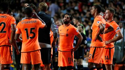 Liverpool's Mohamed Salah with manager Juergen Klopp and teammates after a pre-season friendly in Hong Kong. Bobby Yip / Reuters