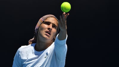 Iran's Meshkatolzahra Safi hits a returns against Belgium's Sofia Costoulas during their junior girls' singles match on day nine of the Australian Open tennis tournament in Melbourne on January 25, 2022. (Photo by Paul Crock / AFP) / -- IMAGE RESTRICTED TO EDITORIAL USE - STRICTLY NO COMMERCIAL USE --