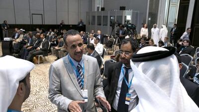 Sidi Mohamed Maadh, second left, the head of Mauritania's delegation, talks with Adel Abdulla Al Hosani, right, Abu Dhabi Fund for Development director of operations, and Thani Al Zeyoudi, a UAE delegation member. Silvia Razgova / The National