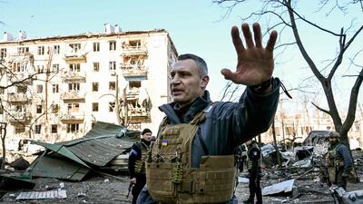 Kyiv's mayor Vitali Klitschko keeps people away from a five-storey residential building that partially collapsed after shelling on March 18. AFP
