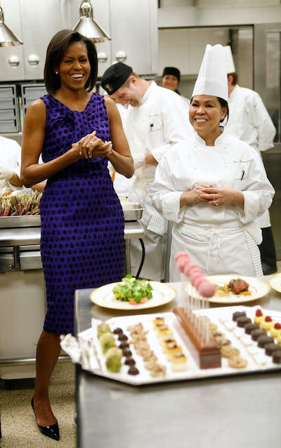 Cristeta Comerford with former first lady Michelle Obama during a kitchen preview for a dinner in 2009. Reuters