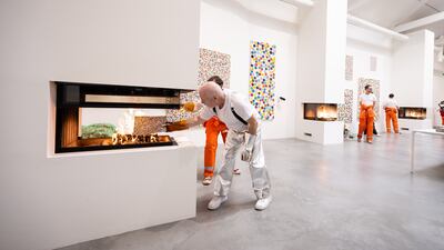 Damien Hirst takes part in the burning of his artworks at Newport Street Gallery in London, England. Getty Images