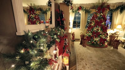 The three-bedroom villa features lavish decorations, with the living room done up in traditional Christmas colours