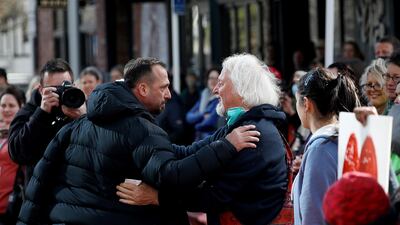 Temel Atacocugu (L), a survivor of the twin mosque shootings, thanks members of the public outside the High Court after the conclusion of the sentencing hearing for Australian white supremacist Brenton Tarrant in Christchurch. AFP