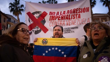 Protestors in Malaga, southern Spain, take part in a demonstration against the US operation in Venezuela. AFP