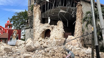 Damage outside the Archdiocesan Shrine of Santa Rosa de Lima in Daanbantayan, Cebu. AP