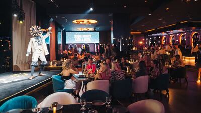 Nova at Address Dubai Marina has a central stage that features singers, musicians and aerialists. Photo: Nova Restaurant & Lounge