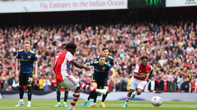 Arsenal's Bukayo Saka scores their second goal from the penalty spot. Reuters