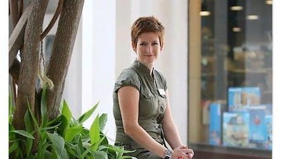 DUBAI, UNITED ARAB EMIRATES - April 28,2011: Lesley Cully working as a part time sales assistant for Magrudy´s on beach road in Dubai. (Pawan Singh / The National) For Personal Finance.