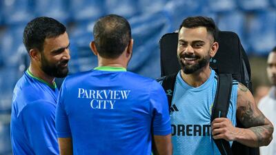 Virat Kohli and Fakhar Zaman interact during training. AFP