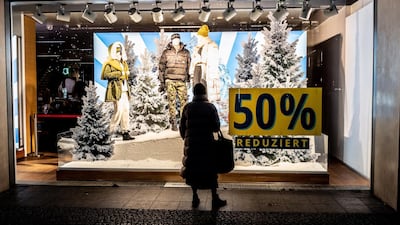 A pedestrian outside a closed shop in Berlin, Germany. The November decline in eurozone retail sales was the most since April when the first wave of lockdowns was fully under way. EPA