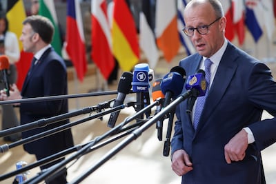 German Chancellor Friedrich Merz, right, and French President Emmanuel Macron speaking before the summit in Brussels. EPA