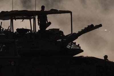 Israeli troops at the border with Gaza. AFP
