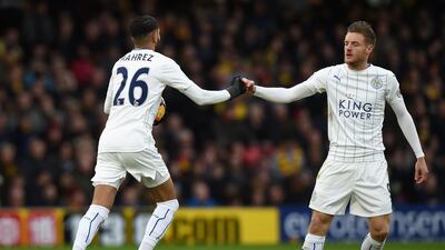 Jamie Vardy of Leicester City congratulates teammate Riyad Mahrez on scoring a penalty against Watford. Tony Marshall / Getty Images
