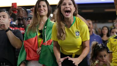 A Brazil fan screams as Brazil forward Neymar walks on the field before the match. AP Photo