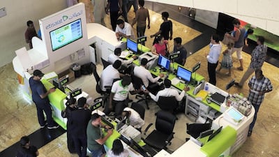 Final call: mobile phone users rush to register their numbers at Mall of the Emirates. Jeffrey E Biteng / The National