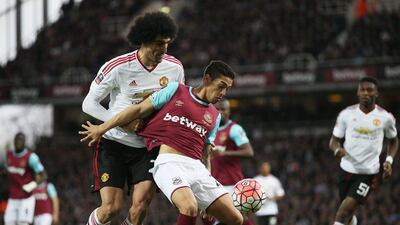 Marouane Fellaini of Manchester United challenges Manuel Lanzini of West Ham United during the FA Cup, sixth round replay between West Ham United and Manchester United at the Boleyn Ground on April 13, 2016 in London, England. (Photo by Ian Walton/Getty Images)