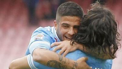 Lorenzo Insignie, left, celebrates with Napoli teammate Edinson Cavani after scoring the winner against Cagliari. Salvatore Laporta / AP Photo